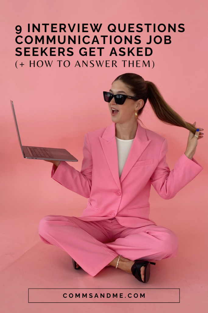 Woman with ponytail and pink blazer set holding laptop