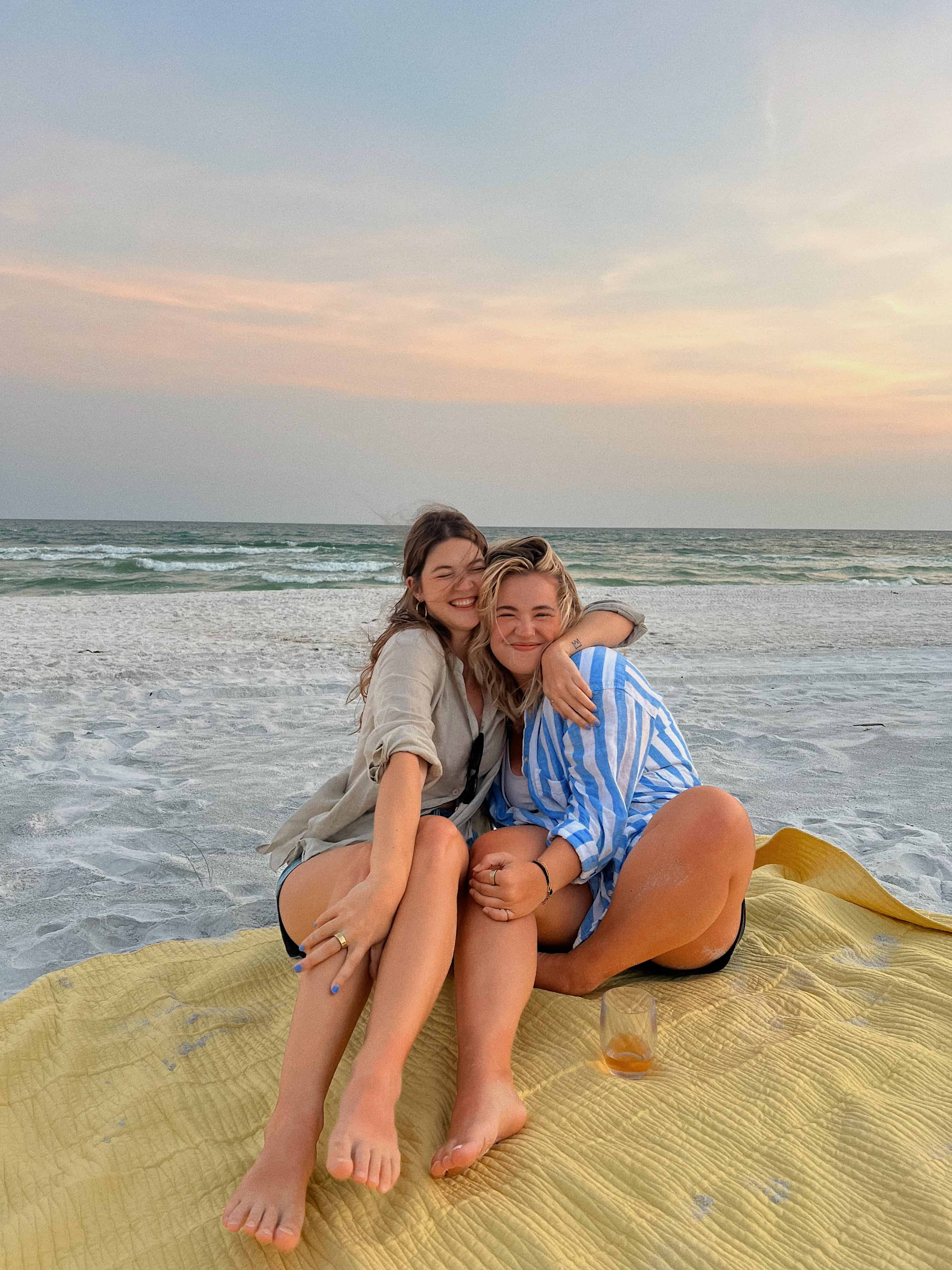 Friends hugging on beach