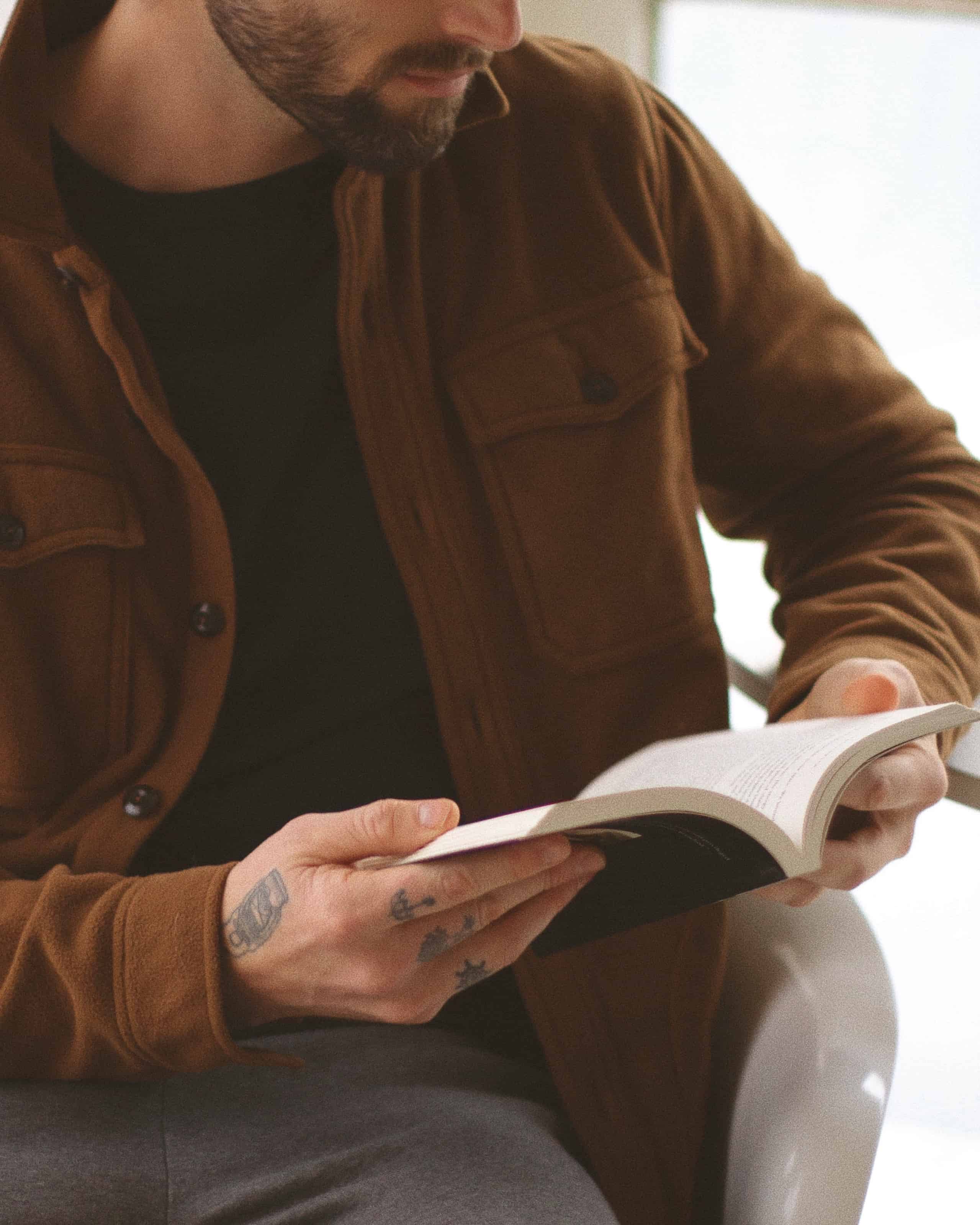 Man reading story in book