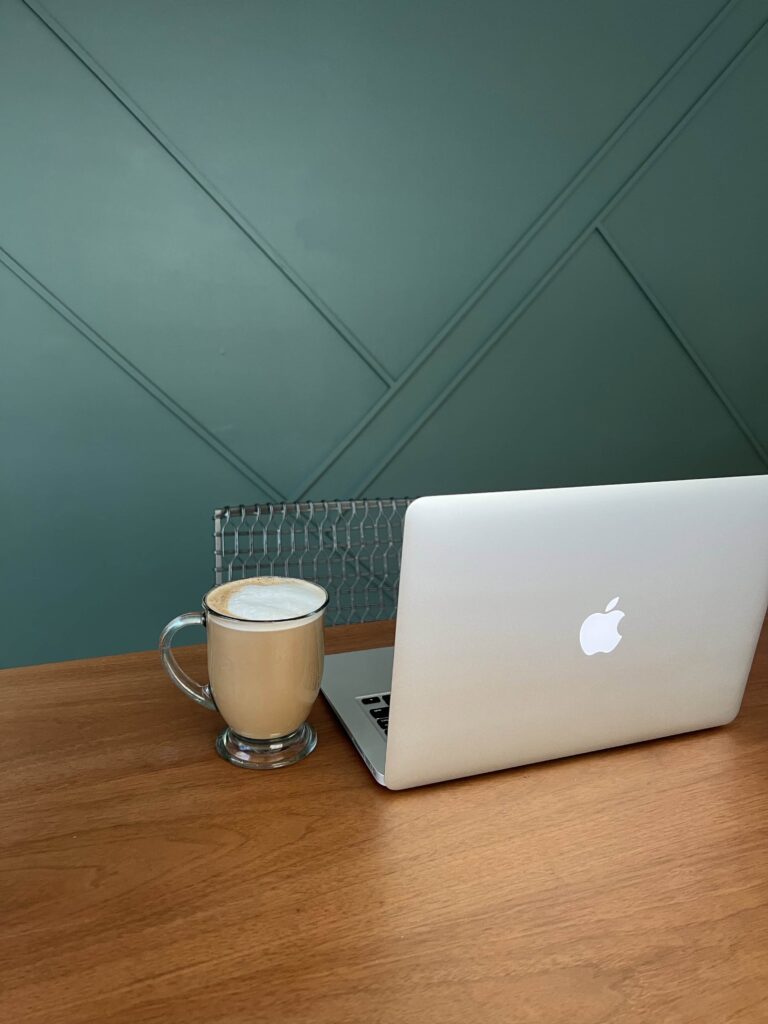 Computer on desk with coffee