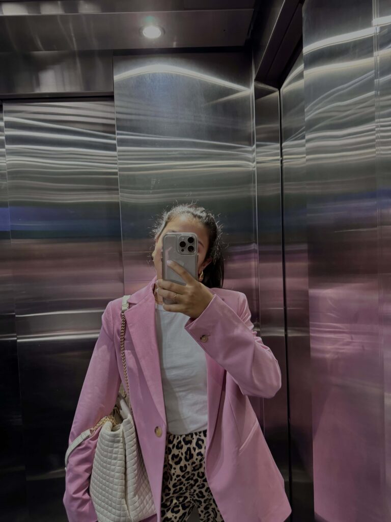 Woman taking photo in elevator