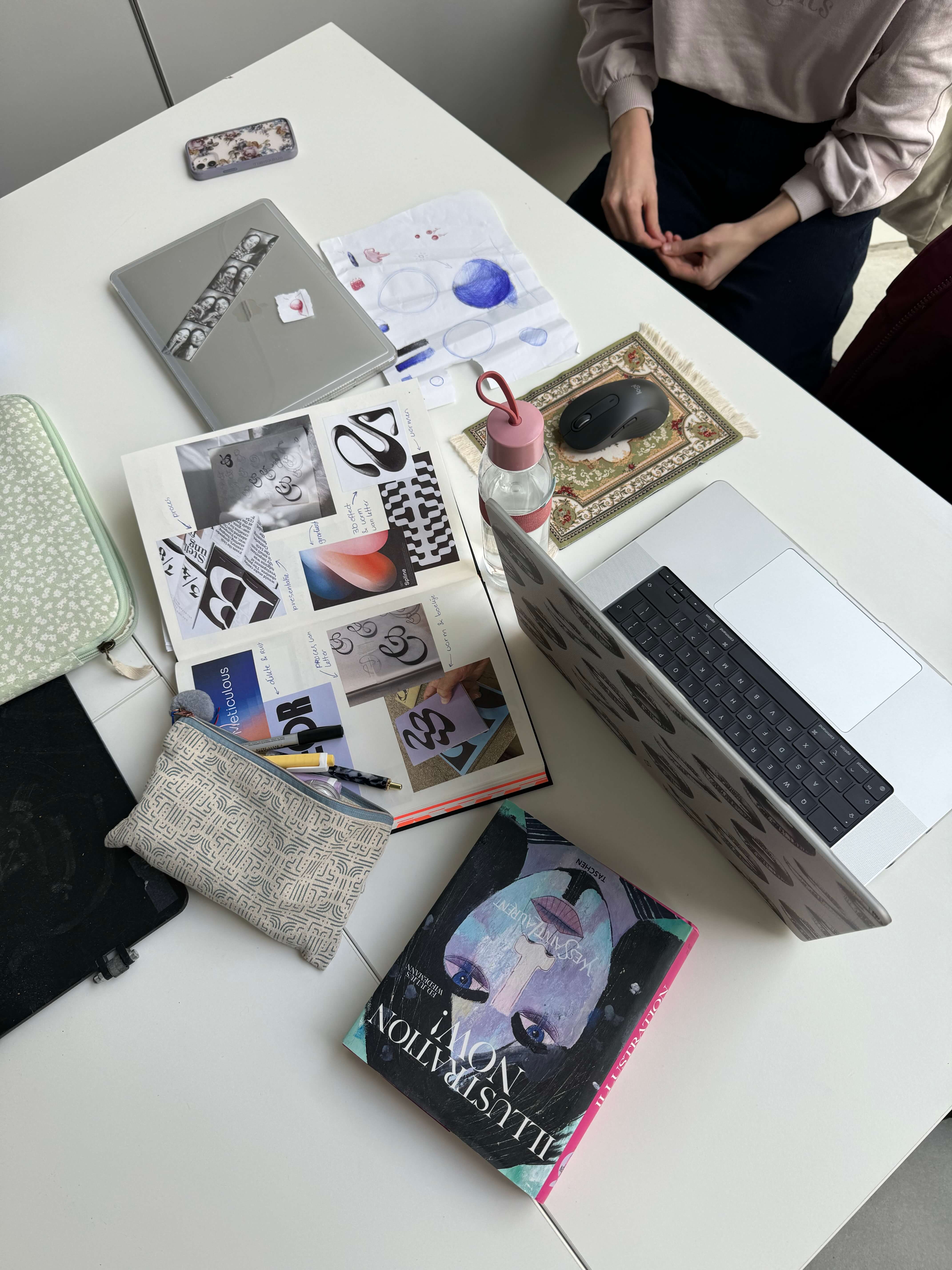 computers and papers laid on table