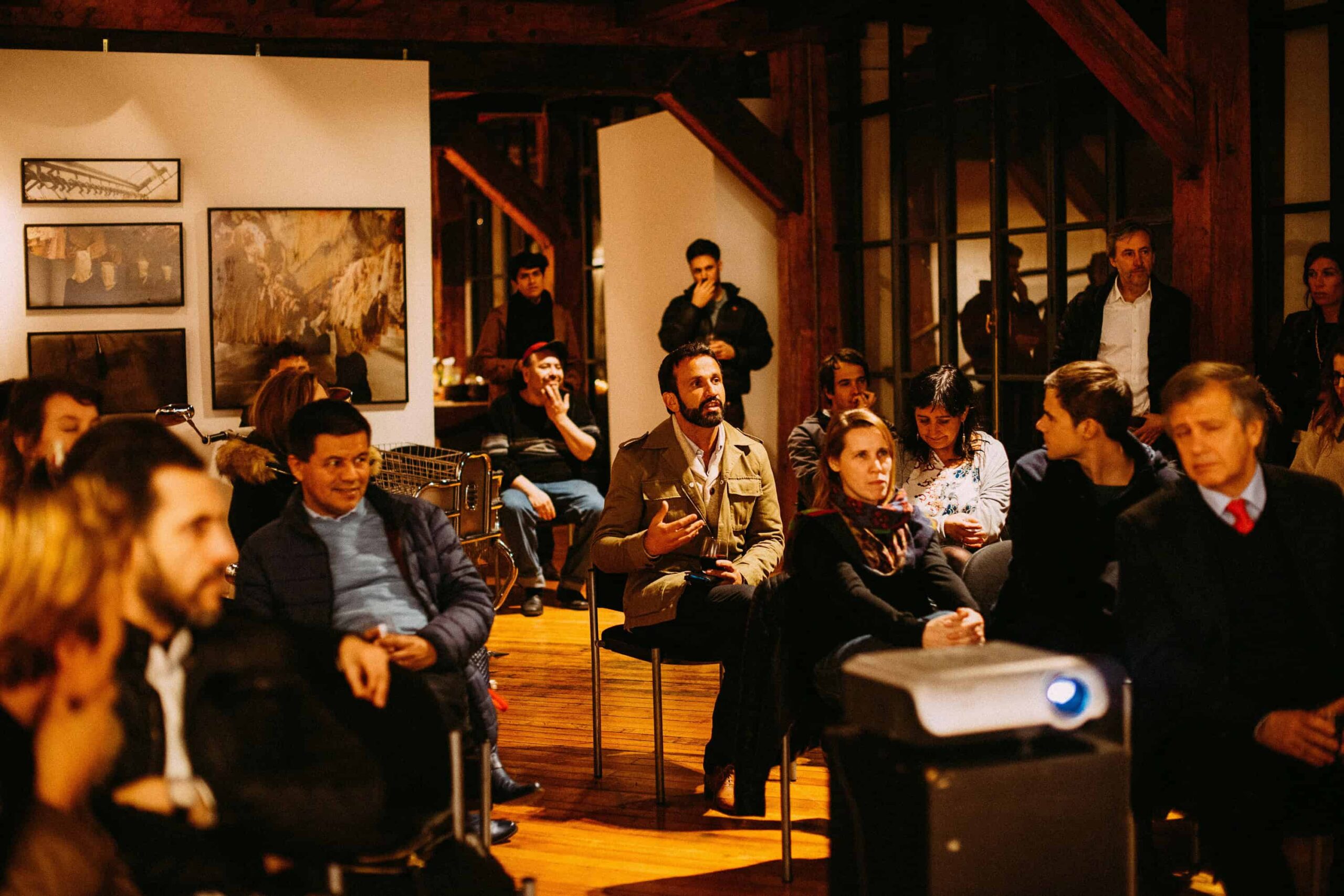 group of people sitting and listening to presentation