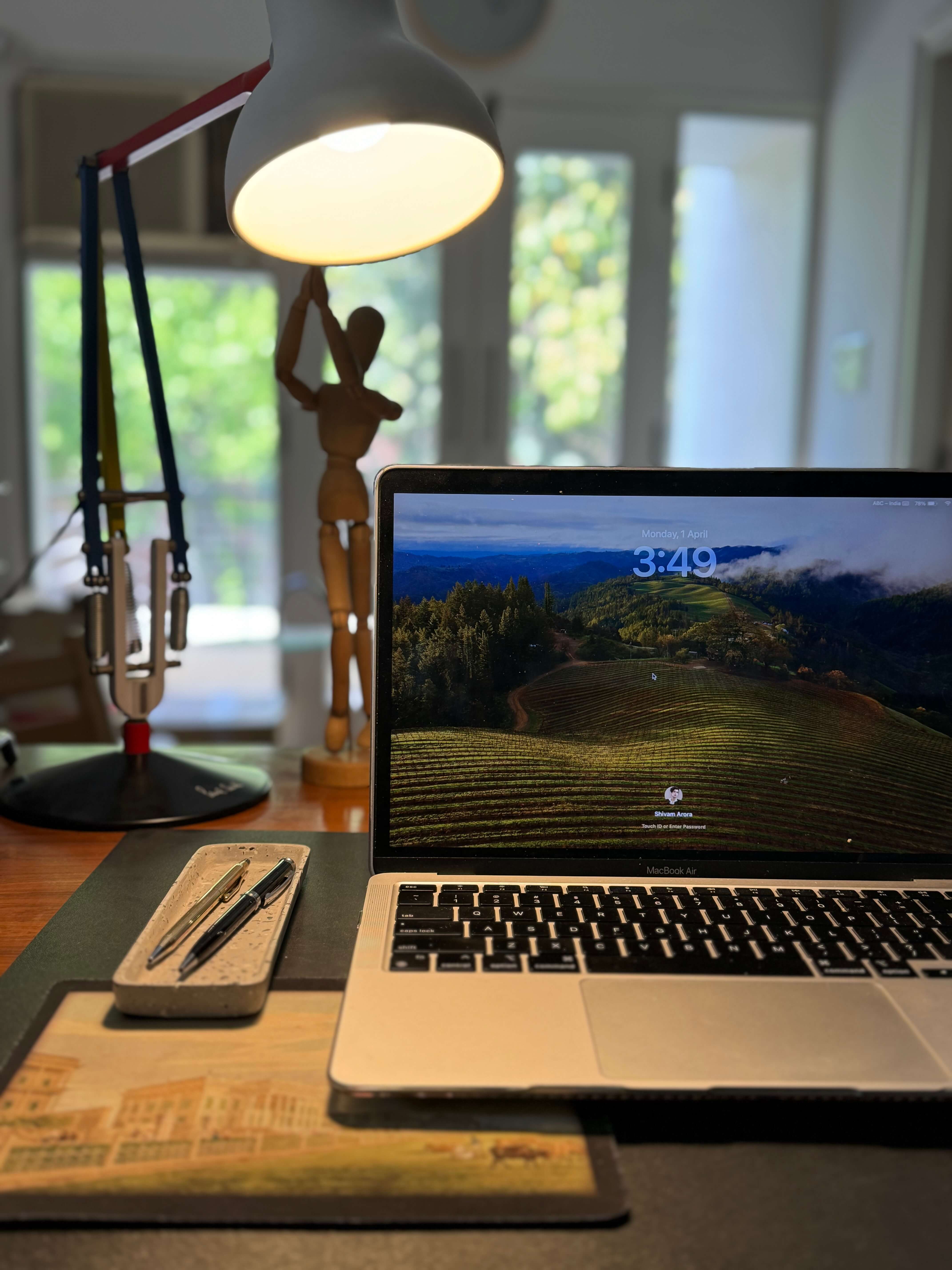 Laptop and lamp on desk